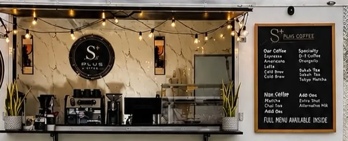 Inside the S+ serving window: espresso machine, grinders and the chalkboard menu